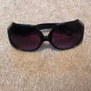Black octagon-like sunglasses. Light wear.